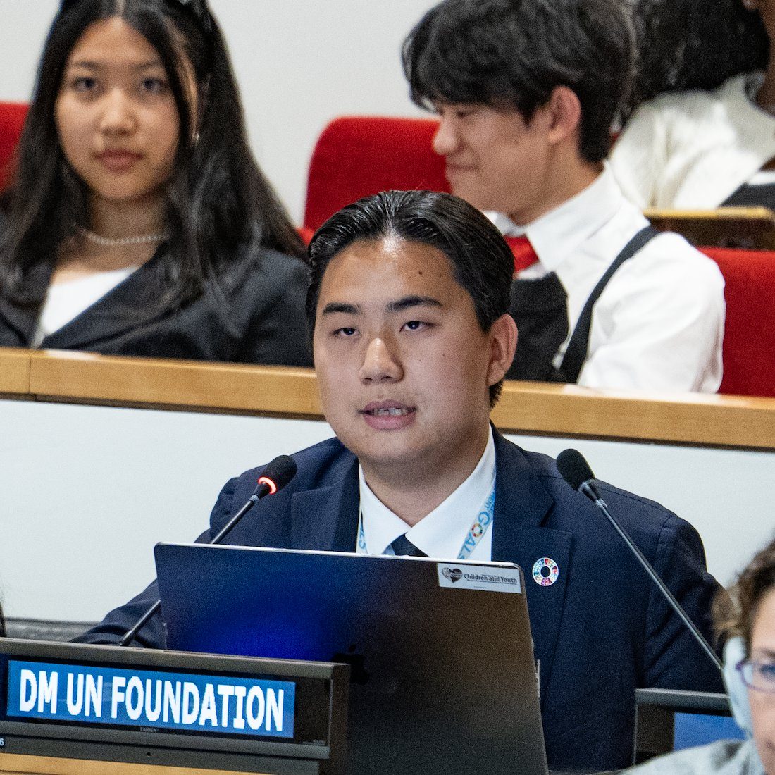Executive Director Jaewon Choi at a DMUN Foundation desk